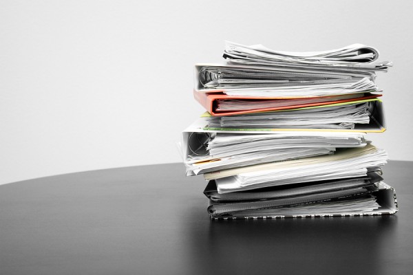 Stack Of Folders And Documents On Office Table