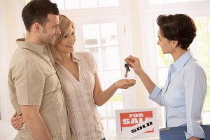 Real Estate Agent Handing Over Keys